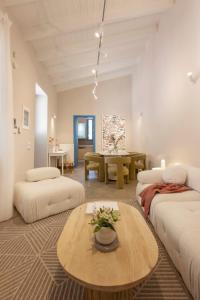 a living room with two couches and a table at Villa Plaka 3BR 9ppl PrivateYard 200m Metro&Museum in Athens