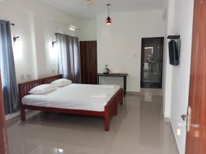 CHAEL Airport Residency,Nedumbassery Cochin客房内的一张或多张床位