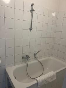 Koupelna v ubytování City Inn 24H Self Check-In by H&H Hotels