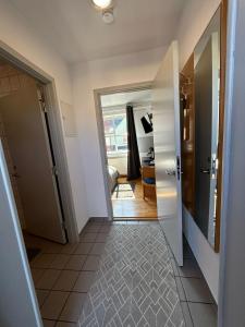 a hallway with a door leading to a room at Pension Stral-Sund UG in Stralsund