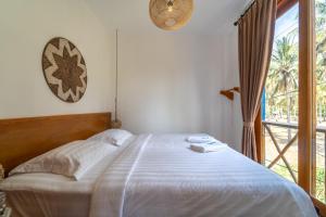 Postel nebo postele na pokoji v ubytování Yulaman Hotel + 29 fotografií