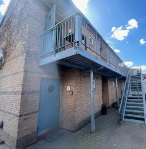 a staircase on the side of a brick building at Pension Stral-Sund UG in Stralsund +4 photos