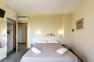 Posteľ alebo postele v izbe v ubytovaní Hotel La Siesta