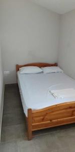 Postel nebo postele na pokoji v ubytování Kalouda Rooms