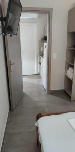 Postel nebo postele na pokoji v ubytování Kalouda Rooms