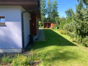 a view of the side of a house with a yard at Bungalov v Krásné Lípě in Krásná Lípa