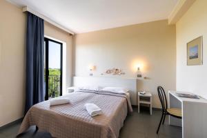 Posteľ alebo postele v izbe v ubytovaní Hotel La Siesta
