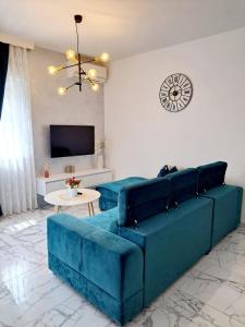 TV a/nebo společenská místnost v ubytování Amellia