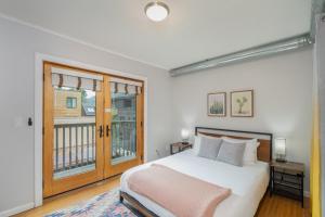 a bedroom with a bed and a large window at Comfy Casual Near Gondola & Main Street! Needle Rock 3 condo in Telluride