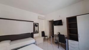 TV a/nebo společenská místnost v ubytování Domo - Guest-House Il Nespolo Fiorito