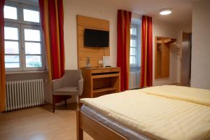 Postel nebo postele na pokoji v ubytování Hotel & Café Ritter von Böhl
