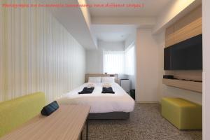 Postel nebo postele na pokoji v ubytování Fourz Hotel Kintetsu Osaka-Namba + 17 fotografií