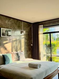 Postel nebo postele na pokoji v ubytování Baankao Resort Rayong
