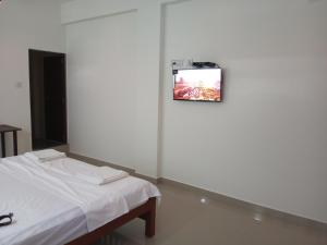 CHAEL Airport Residency,Nedumbassery Cochin客房内的一张或多张床位