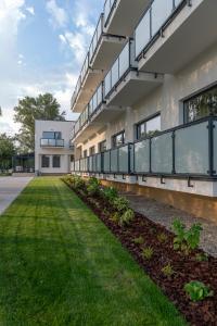 an external view of a building with a lawn at Thermal Hotel Campino in Dunajská Streda