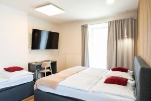 Ліжко або ліжка в номері Hotel Sharingham