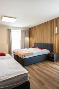 Ліжко або ліжка в номері Hotel Sharingham