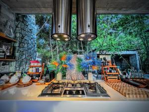 a kitchen with a stove and a sink in a room at Z VILLA InstaDream Luxury 180 Sea & Sunset in Ban Taling Ngam