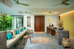 a living room with a couch and a table at Viroth's Hotel in Siem Reap