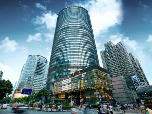 a tall skyscraper in a city with buildings at Huaqiang Plaza Hotel Shenzhen, Enjoy Complimentary Mini Bar & Night Snack, Add breakfast - enjoy complimentary afternoon tea in Shenzhen
