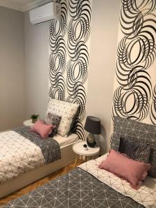 Ένα ή περισσότερα κρεβάτια σε δωμάτιο στο Cactus Apartment