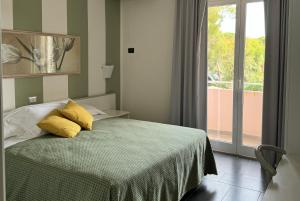 Кровать или кровати в номере Hotel dei Coralli