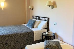 Кровать или кровати в номере Hotel dei Coralli