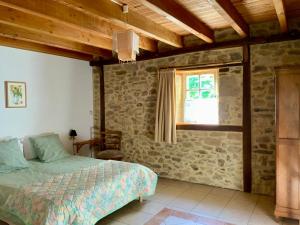Postel nebo postele na pokoji v ubytování Gîte Fénil Dans Le Lot Avec Vue Panoramique