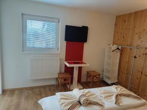Rúm í herbergi á Pension Archa Mikulov