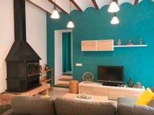 a living room with a couch and a fireplace at Casa Fina in Anna