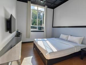 Postel nebo postele na pokoji v ubytování H Benjamin Residence