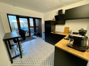 a kitchen with a coffee maker on a counter at Boardinghouse 44 in Kierspe