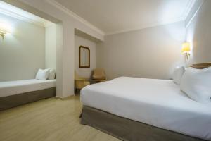 Cama o camas de una habitación en Crisol Jardines de Córdoba