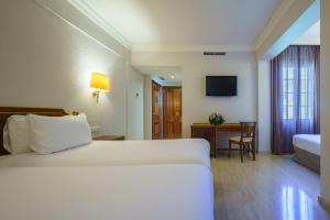 Cama o camas de una habitación en Crisol Jardines de Córdoba