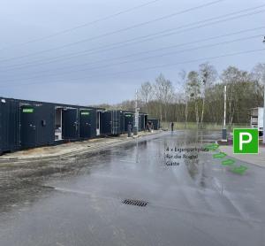 an empty parking lot with water on the street at Roatel Schipkau (A13) my-roatel-com in Schipkau