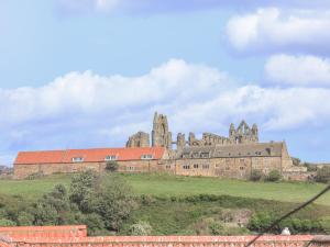 an old castle on top of a hill at Adventure Cottage in Whitby