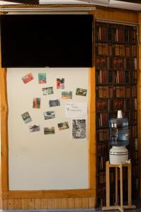 a bulletin board in a library with pictures on it at Tammispea puhkeküla in Tammispea