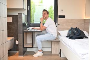 Postel nebo postele na pokoji v ubytování Roatel Schkeuditz A9 my-roatel-com