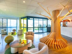 Area soggiorno di ibis Styles Guéret