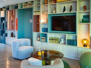 Area soggiorno di ibis Styles Guéret