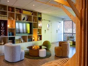 Area soggiorno di ibis Styles Guéret