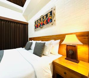 Postel nebo postele na pokoji v ubytování Gangga Guest House