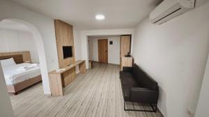 Кровать или кровати в номере Aremsis Holiday Resort