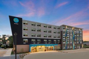 a building with a two sign in front of it at Tru By Hilton Lincoln East in Lincoln