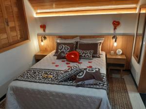 a bedroom with a bed in a small room at Chalé Sognare Due in Santa Teresa