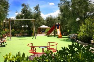 a park with a playground with a table and chairs at Residence Valleverde in Vieste