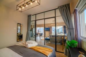 a bedroom with a bed and a living room at Two Bedroom Apartment, Spacious & Newly Renovated, Three Minutes from the Beach in Limassol