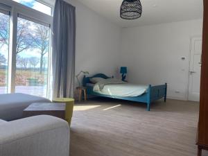 Postel nebo postele na pokoji v ubytování Vakantiehuis Buitengewoon