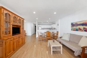 a living room with a couch and a table at Apto Tomasol in Los Cristianos