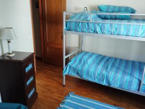 Postel nebo postele na pokoji v ubytování Dom Camilo Alojamento local